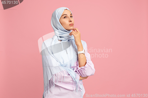 Image of The arab woman in hijab. Portrait of serious girl, posing at studio background