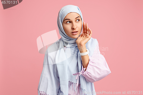 Image of Happy arab woman in hijab. Portrait of smiling girl, posing at studio background