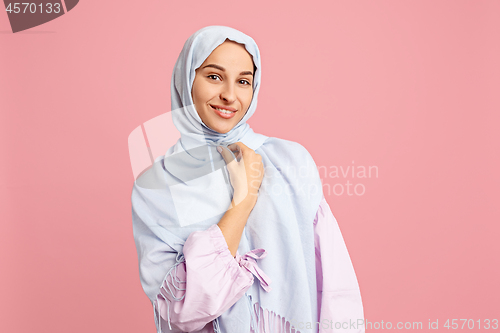 Image of Happy arab woman in hijab. Portrait of smiling girl, posing at studio background