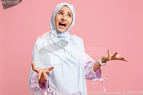 Image of Argue, arguing concept. arab woman in hijab. Portrait of girl, posing at studio background