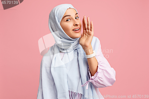 Image of Happy arab woman in hijab. Portrait of smiling girl, posing at studio background