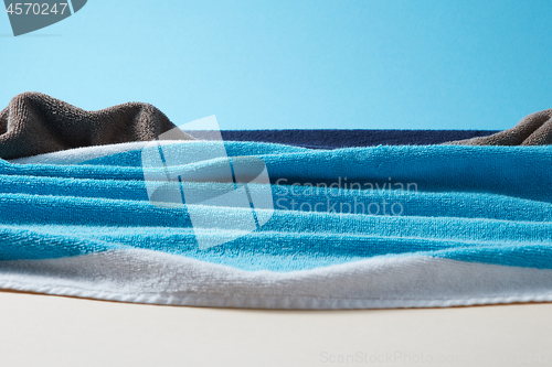 Image of Seascape with waves and rocks from colorful terry towels.