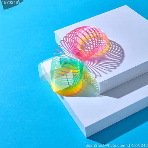 Image of Classical slinky spring toy walking down the strairs.
