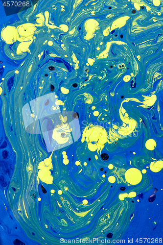 Image of Mixed acrylic paint background in yellow-blue colours.