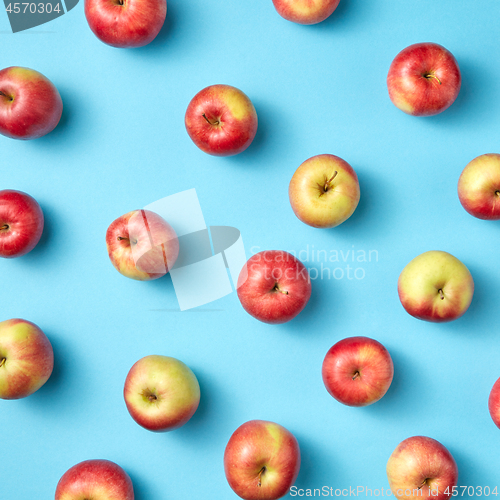 Image of Fruit apples pattern on blue.