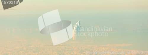 Image of Skyline of Dubai beachfront with Burj Al Arab hotel on Jumeirah beach seen from Burj Khalifa viewpoint.