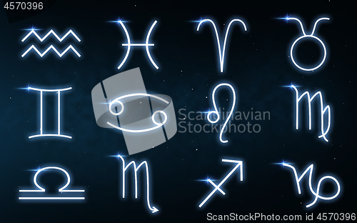 Image of set of zodiac signs over night sky background