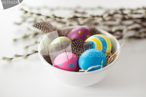 Image of colored easter eggs and pussy willow branches