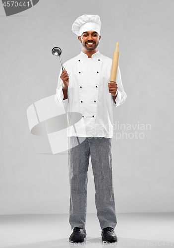 Image of happy indian chef with ladle and rolling-pin