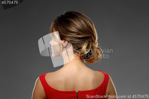 Image of portrait of beautiful young woman in red dress