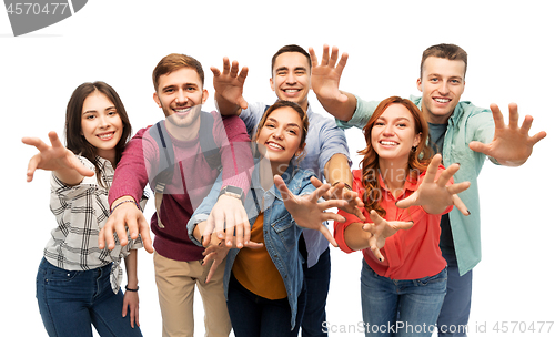 Image of group of happy students over white background