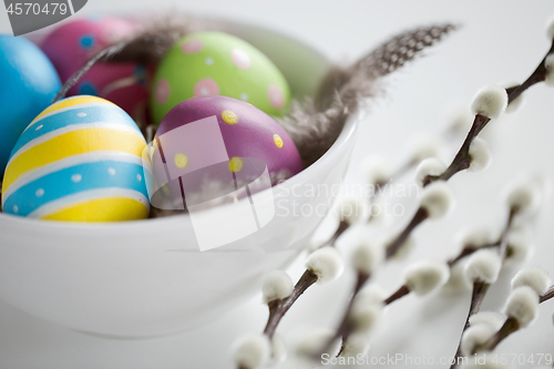 Image of colored easter eggs and pussy willow branches