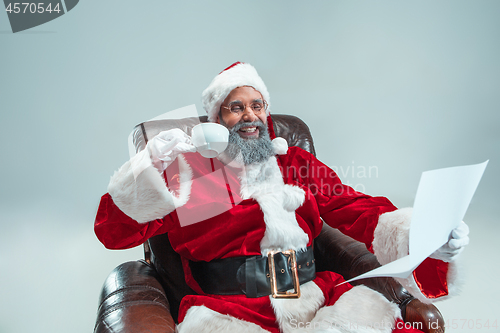 Image of Funny guy in christmas hat. New Year Holiday. Christmas, x-mas, winter, gifts concept.