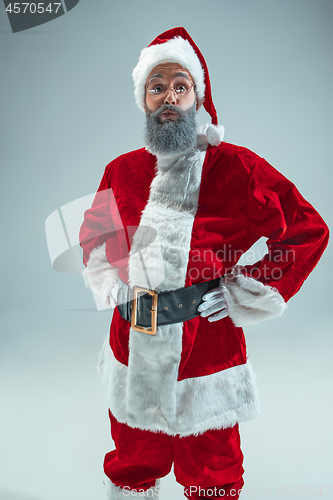 Image of Funny guy in christmas hat. New Year Holiday. Christmas, x-mas, winter, gifts concept.