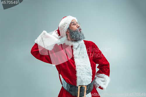 Image of Funny guy in christmas hat. New Year Holiday. Christmas, x-mas, winter, gifts concept.