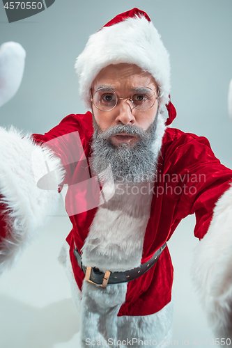 Image of Funny guy in christmas hat. New Year Holiday. Christmas, x-mas, winter, gifts concept.