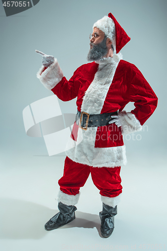 Image of Funny guy in christmas hat. New Year Holiday. Christmas, x-mas, winter, gifts concept.