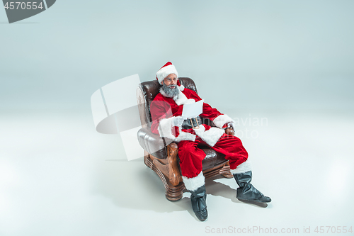 Image of Funny guy in christmas hat. New Year Holiday. Christmas, x-mas, winter, gifts concept.