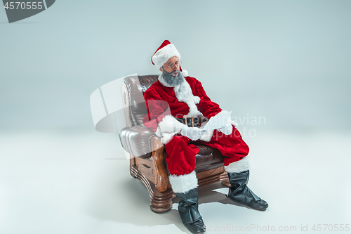 Image of Funny guy in christmas hat. New Year Holiday. Christmas, x-mas, winter, gifts concept.