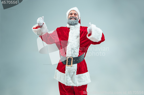 Image of Funny guy in christmas hat. New Year Holiday. Christmas, x-mas, winter, gifts concept.