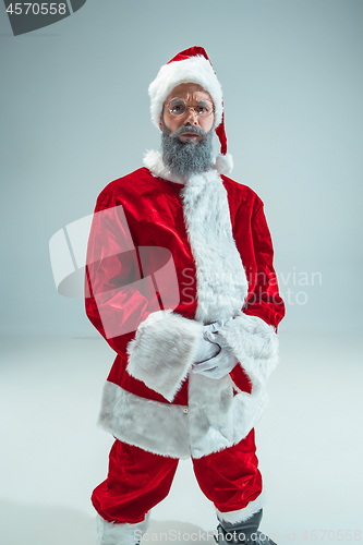 Image of Funny guy in christmas hat. New Year Holiday. Christmas, x-mas, winter, gifts concept.