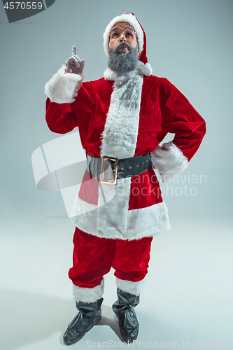 Image of Funny guy in christmas hat. New Year Holiday. Christmas, x-mas, winter, gifts concept.