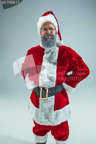 Image of Funny guy in christmas hat. New Year Holiday. Christmas, x-mas, winter, gifts concept.