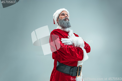 Image of Funny guy in christmas hat. New Year Holiday. Christmas, x-mas, winter, gifts concept.