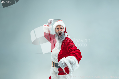 Image of Funny guy in christmas hat. New Year Holiday. Christmas, x-mas, winter, gifts concept.