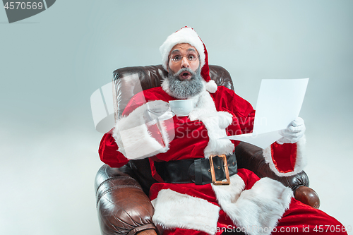 Image of Funny guy in christmas hat. New Year Holiday. Christmas, x-mas, winter, gifts concept.