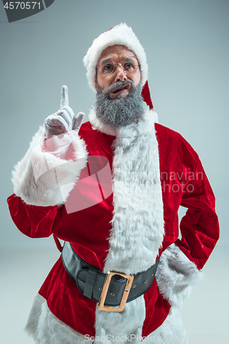 Image of Funny guy in christmas hat. New Year Holiday. Christmas, x-mas, winter, gifts concept.