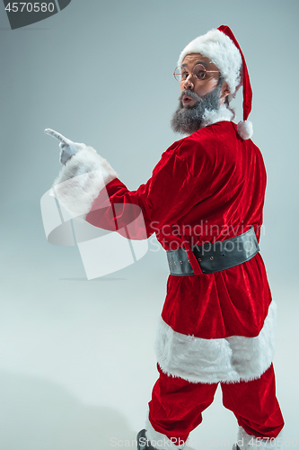 Image of Funny guy in christmas hat. New Year Holiday. Christmas, x-mas, winter, gifts concept.