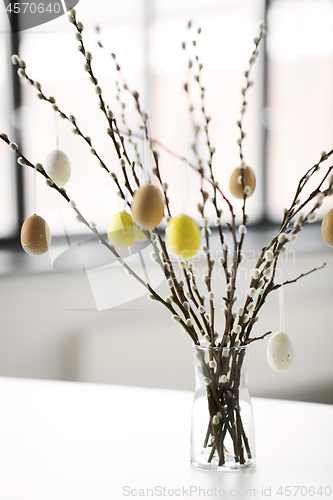 Image of pussy willow branches decorated by easter eggs