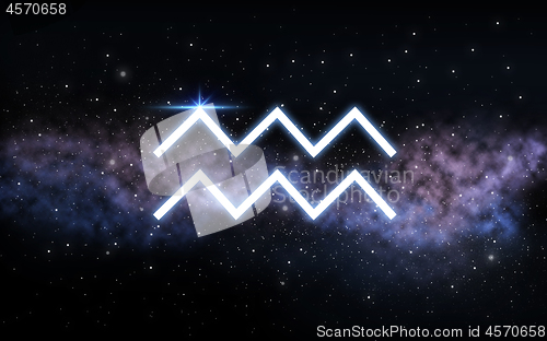 Image of aquarius zodiac sign over night sky and galaxy