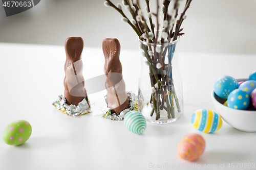 Image of pussy willow, easter eggs and chocolate bunnies