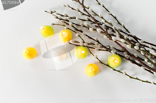 Image of pussy willow branches and easter egg candles