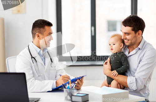 Image of father with baby and doctor at clinic