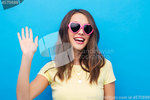 Image of teenage girl in heart-shaped sunglasses