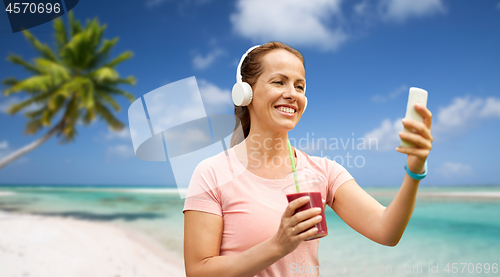 Image of woman with smartphone and shake listening to music