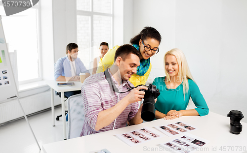 Image of photographers with camera at photo studio