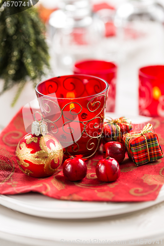 Image of Christmas And New Year Holiday Table Setting.  Place setting for Christmas Dinner. Holiday Decorations. 