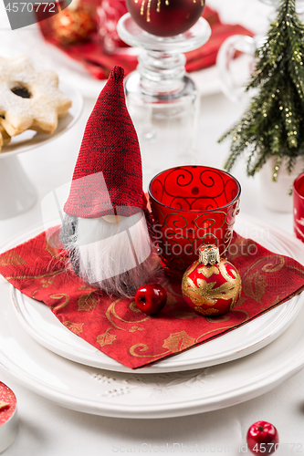 Image of Christmas And New Year Holiday Table Setting.  Place setting for Christmas Dinner. Holiday Decorations. 