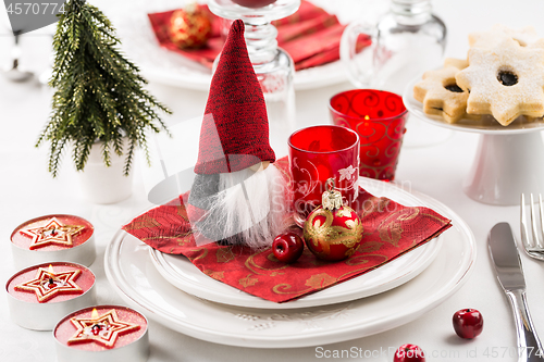 Image of Christmas And New Year Holiday Table Setting.  Place setting for Christmas Dinner. Holiday Decorations. 