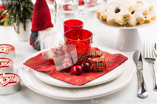 Image of Christmas And New Year Holiday Table Setting.  Place setting for Christmas Dinner. Holiday Decorations. 