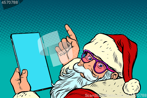 Image of Santa Claus with a tablet. New year and Christmas online sales concept