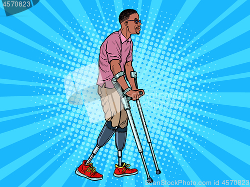 Image of legless african veteran with a bionic prosthesis with crutches. a disabled man learns to walk after an injury. rehabilitation treatment and recovery