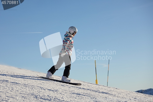 Image of Female snowboarder in the Alps