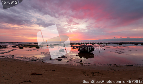 Image of Beautiful morning reflections on the tidal rocks at Bateau Bay Australia