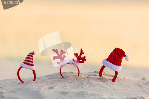 Image of Christmas Santa Hat headbands on beach