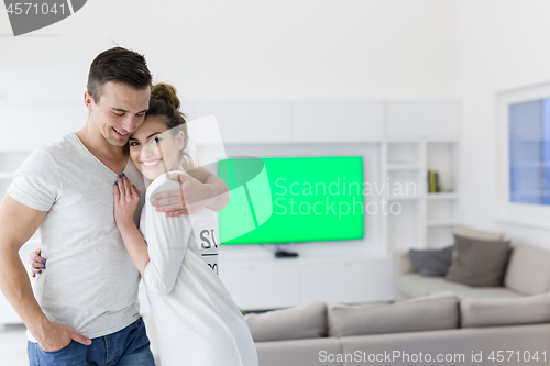 Image of couple hugging in their new home